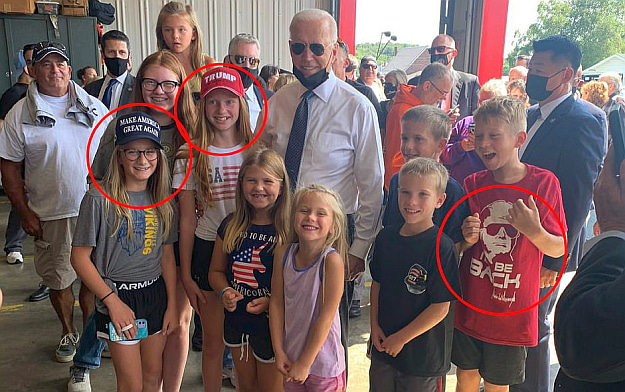 The Thief-in-Chief posed for a photo Saturday, September 11th 2021, with a group of children wearing MAGA
