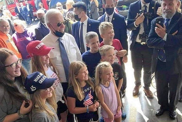 The Thief-in-Chief posed for a photo Saturday, September 11th 2021, with a group of children wearing MAGA